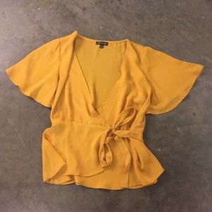 Golden yellow wrap v-neck peplum top